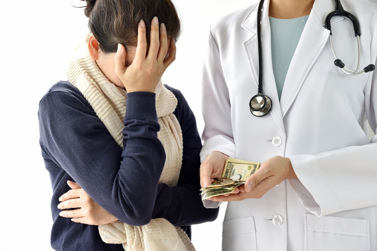 Person reviewing a medical bill at home